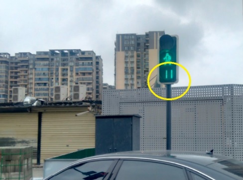 A traffic light with a green light  Description automatically generated