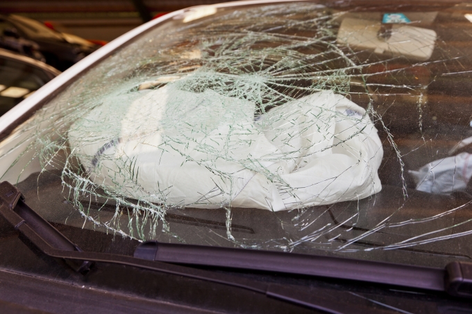 bigstock-a-broken-windshield-in-an-acci-47257951