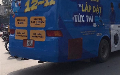 Phạt nghiêm ô tô dán quảng cáo 'kín mít' diễu phố Hà Nội