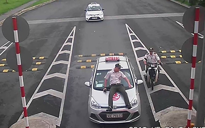 Tài xế taxi hất nhân viên an ninh sân bay Nội Bài lên capo