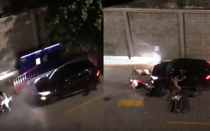 Thanh niên lái ôtô húc ngã hai người trong bãi xe chung cư