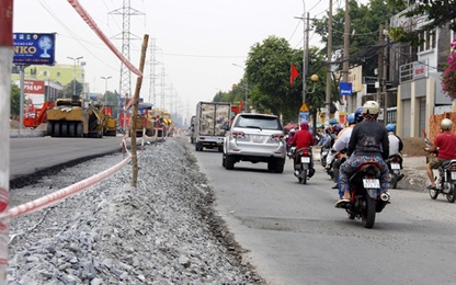 TP.HCM: Hạ cao độ đường Kinh Dương Vương 35cm vì ảnh hưởng nhà dân